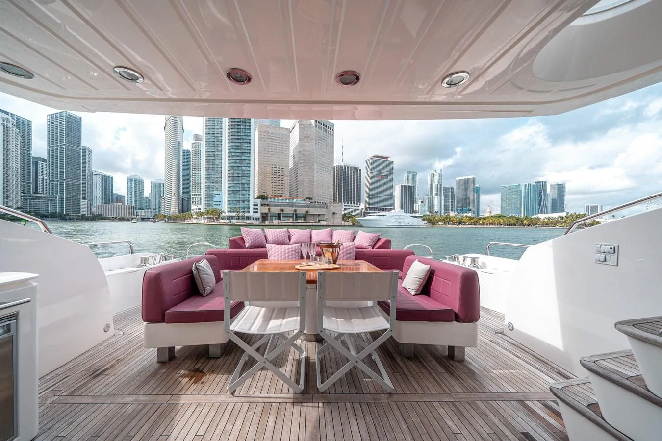 a table and chairs on a balcony overlooking a city aboard SUNSEEKER 84 Yacht for Sale