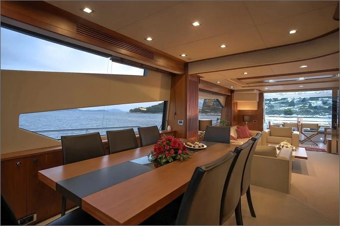 a room with a table and chairs aboard SUNSEEKER 84 Yacht for Sale