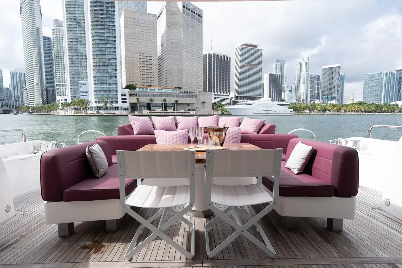 a table and chairs on a deck overlooking a city aboard SUNSEEKER 84 Yacht for Sale
