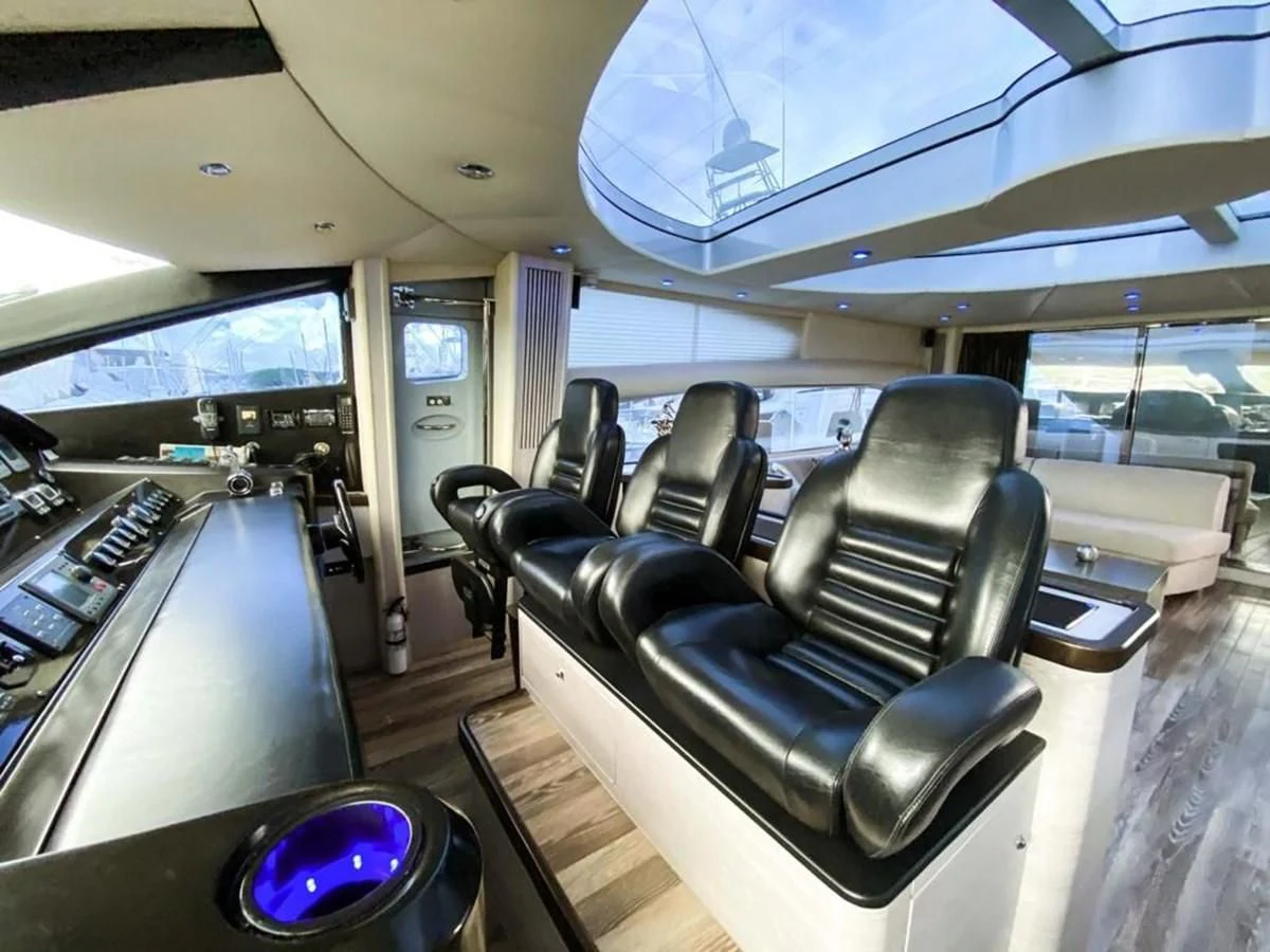 inside of a vehicle with seats and a table and chairs aboard SUNSEEKER 84 Yacht for Sale