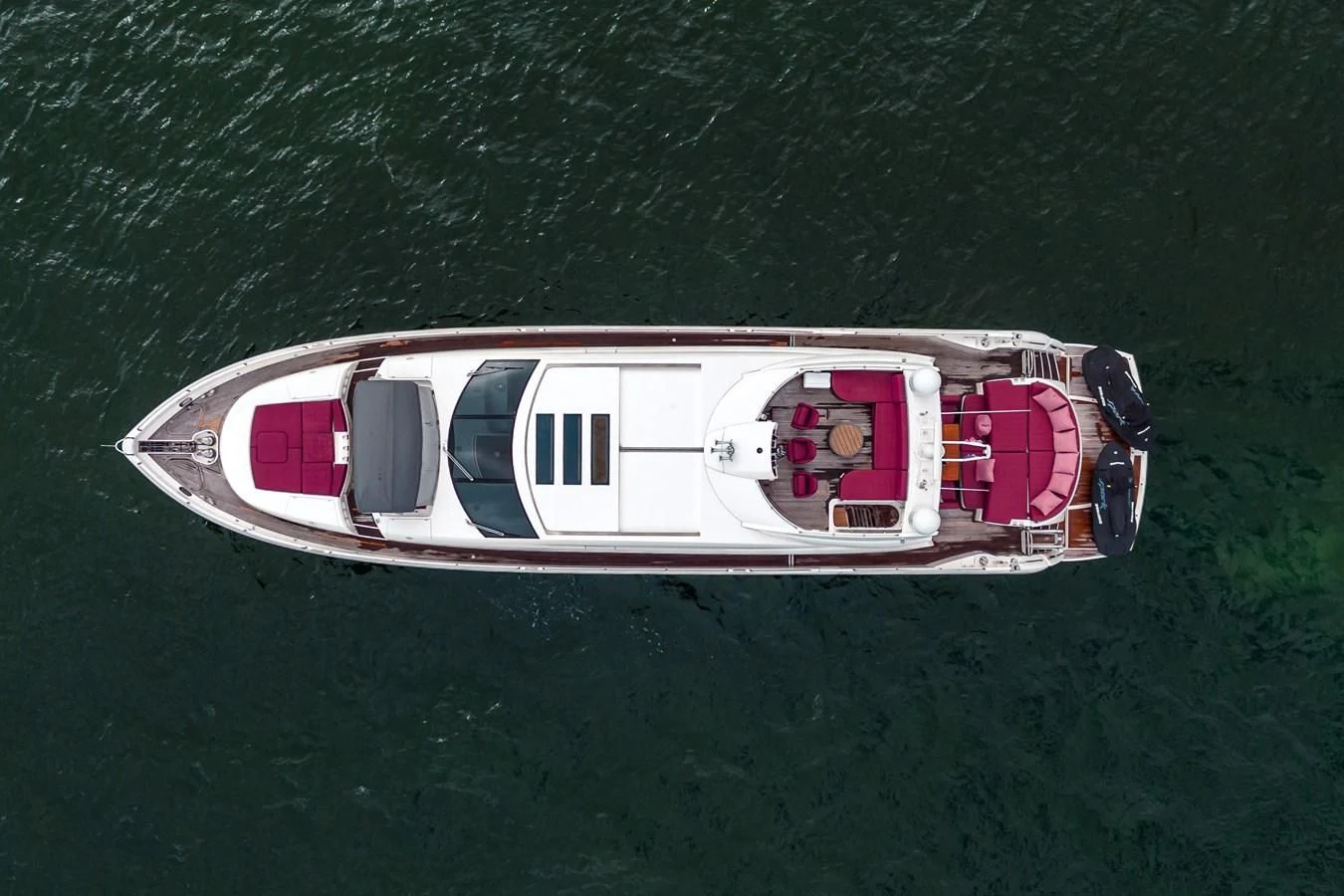 a boat with a couple of seats on the deck aboard SUNSEEKER 84 Yacht for Sale