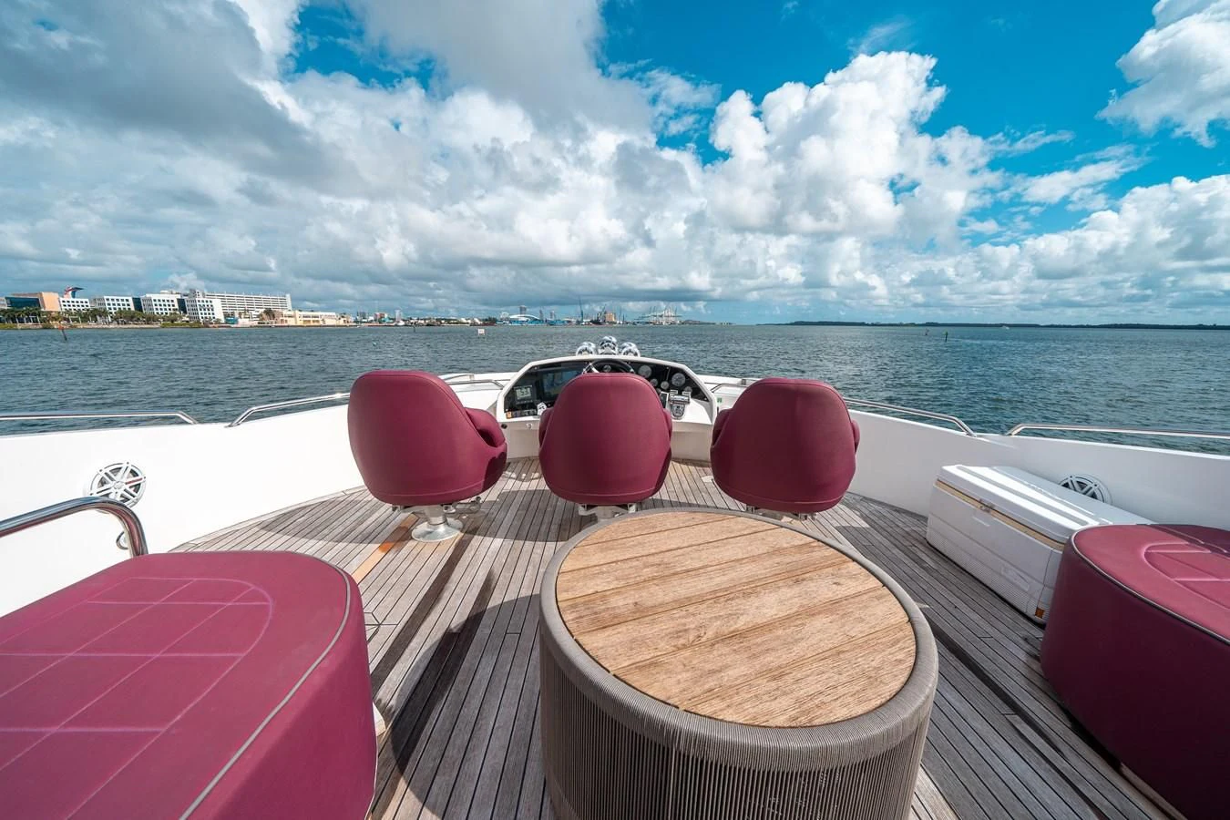 a deck with chairs on it by the water aboard SUNSEEKER 84 Yacht for Sale
