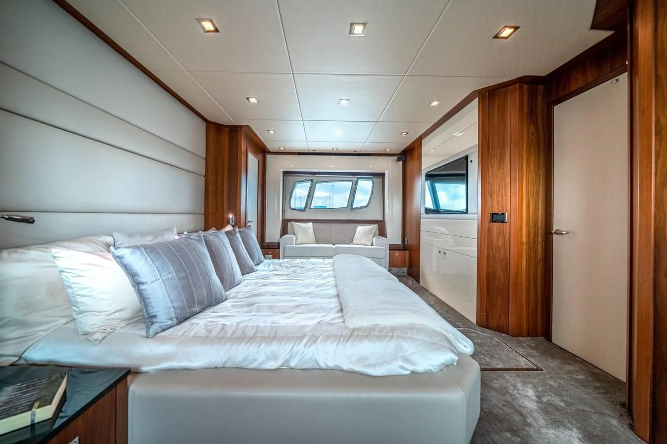 a room with a bed and a desk aboard SUNSEEKER 84 Yacht for Sale
