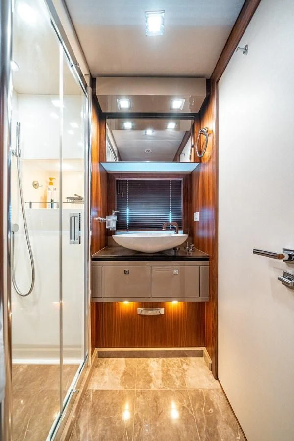 a bathroom with a sink and a shower aboard SUNSEEKER 84 Yacht for Sale