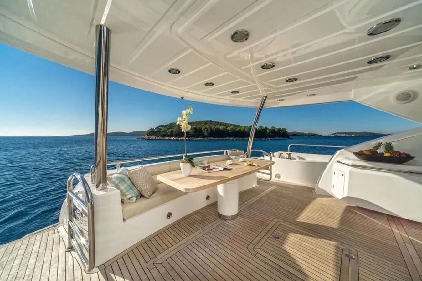 a boat with a table and chairs aboard SUNSEEKER 84 Yacht for Sale