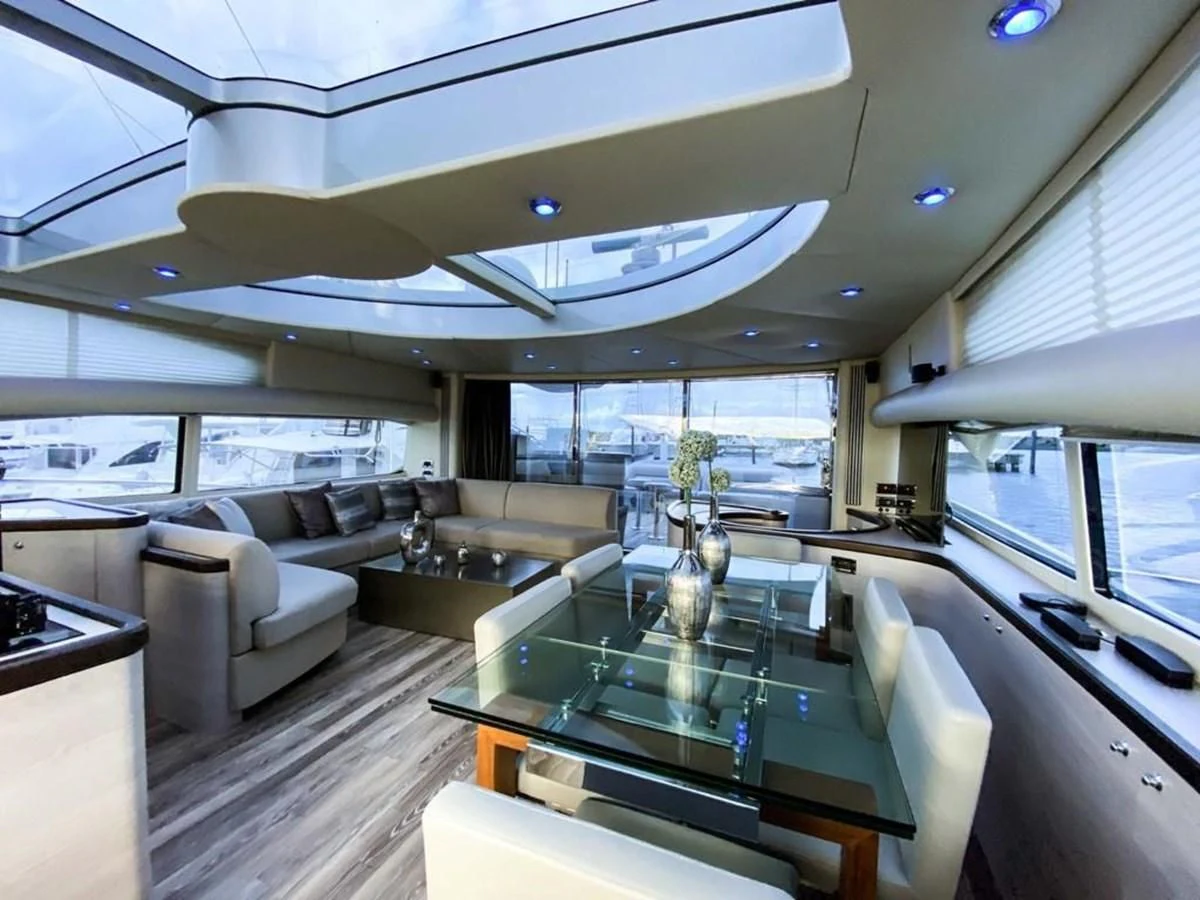 inside of a vehicle with a table and chairs aboard SUNSEEKER 84 Yacht for Sale