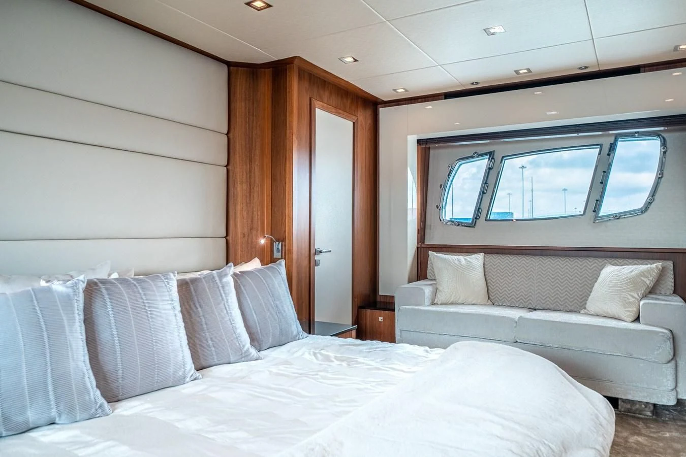 a bed with white pillows aboard SUNSEEKER 84 Yacht for Sale