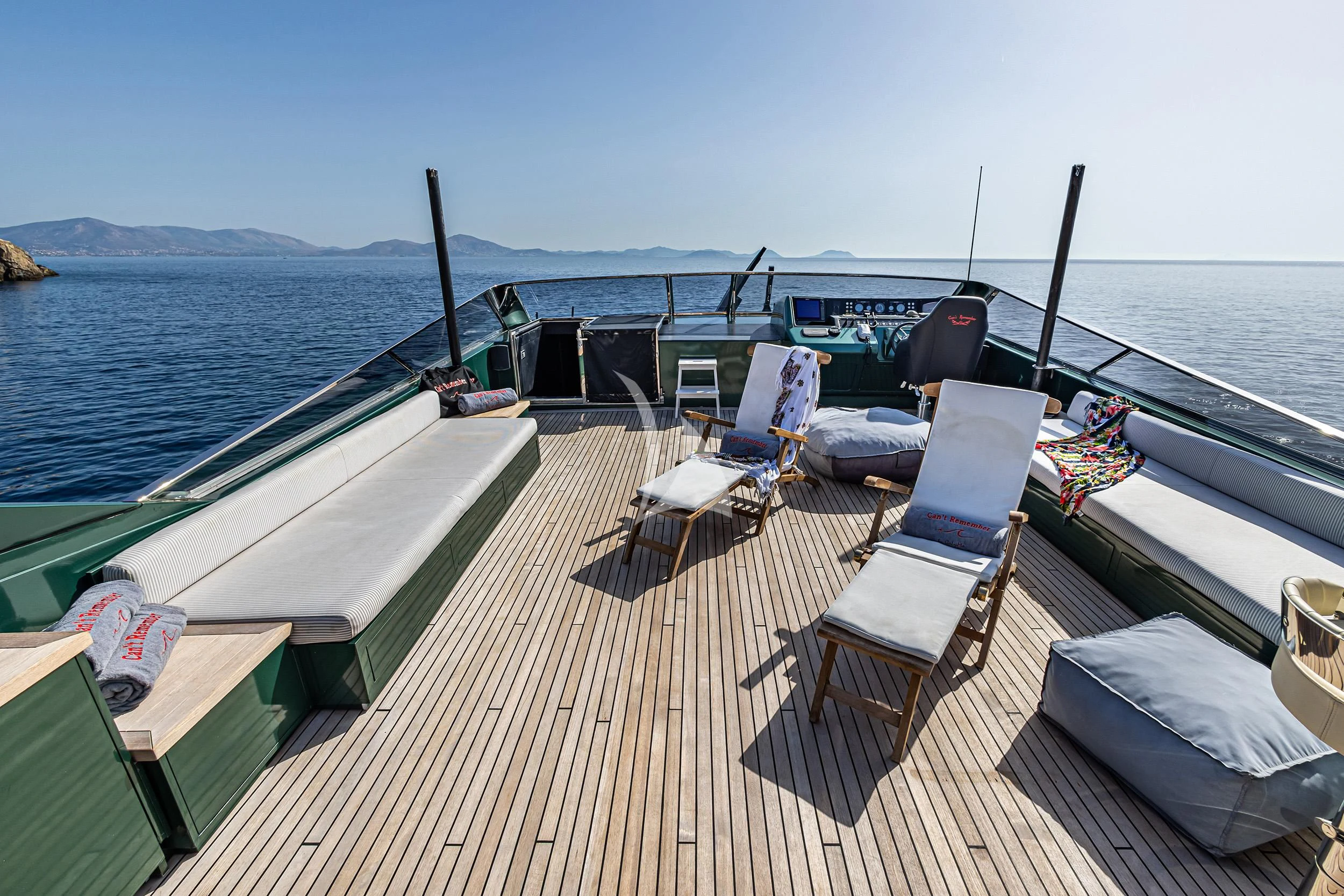 a deck with chairs and a table on it aboard CAN'T REMEMBER Yacht for Sale