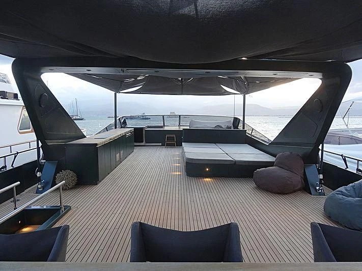 a room with a large deck and a view of the water aboard CAN'T REMEMBER Yacht for Sale