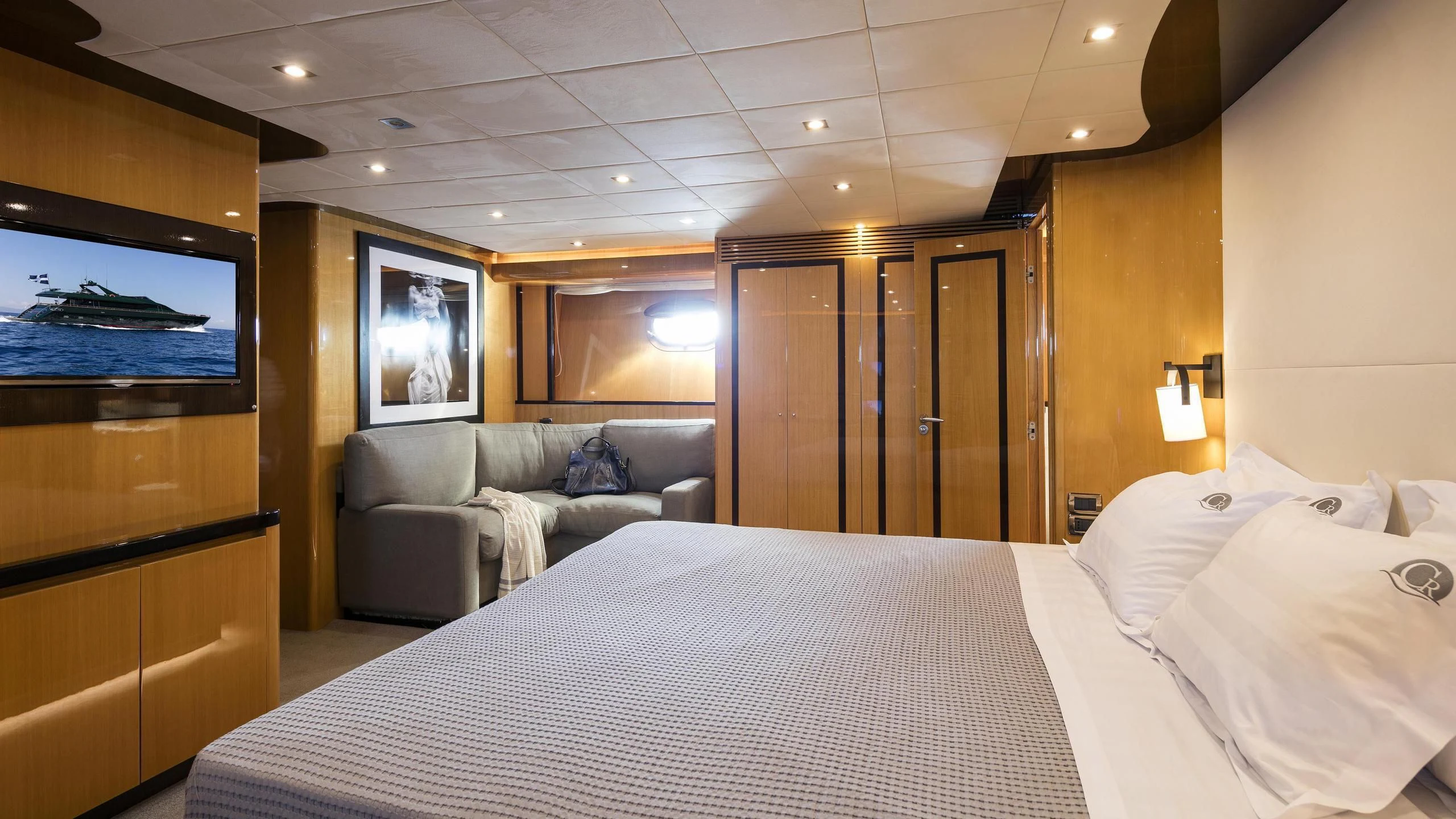 a hotel room with a bed and a television aboard CAN'T REMEMBER Yacht for Sale