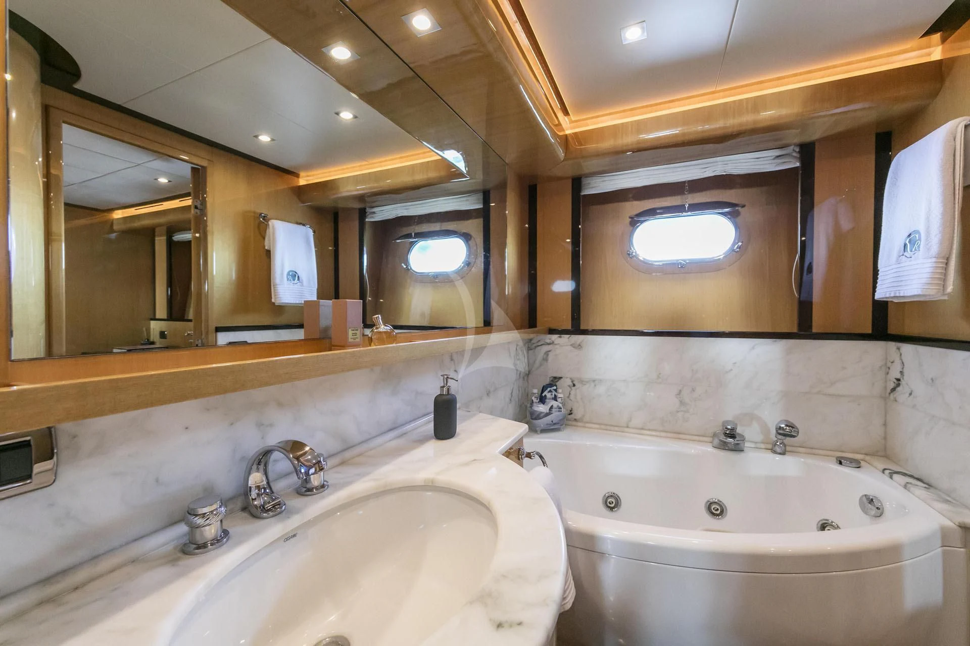 a bathroom with two sinks and a large mirror aboard CAN'T REMEMBER Yacht for Sale