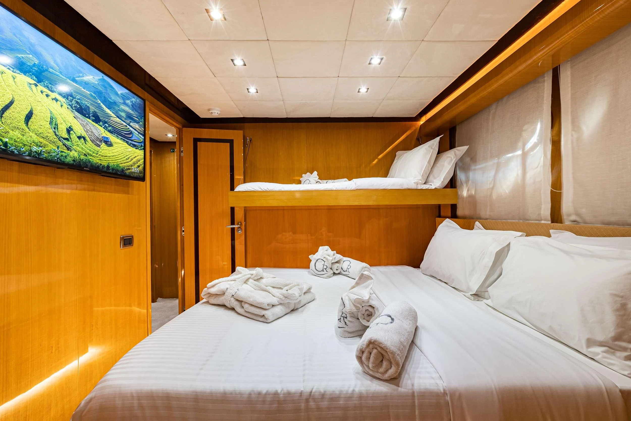 a group of people lying on a bed aboard CAN'T REMEMBER Yacht for Sale