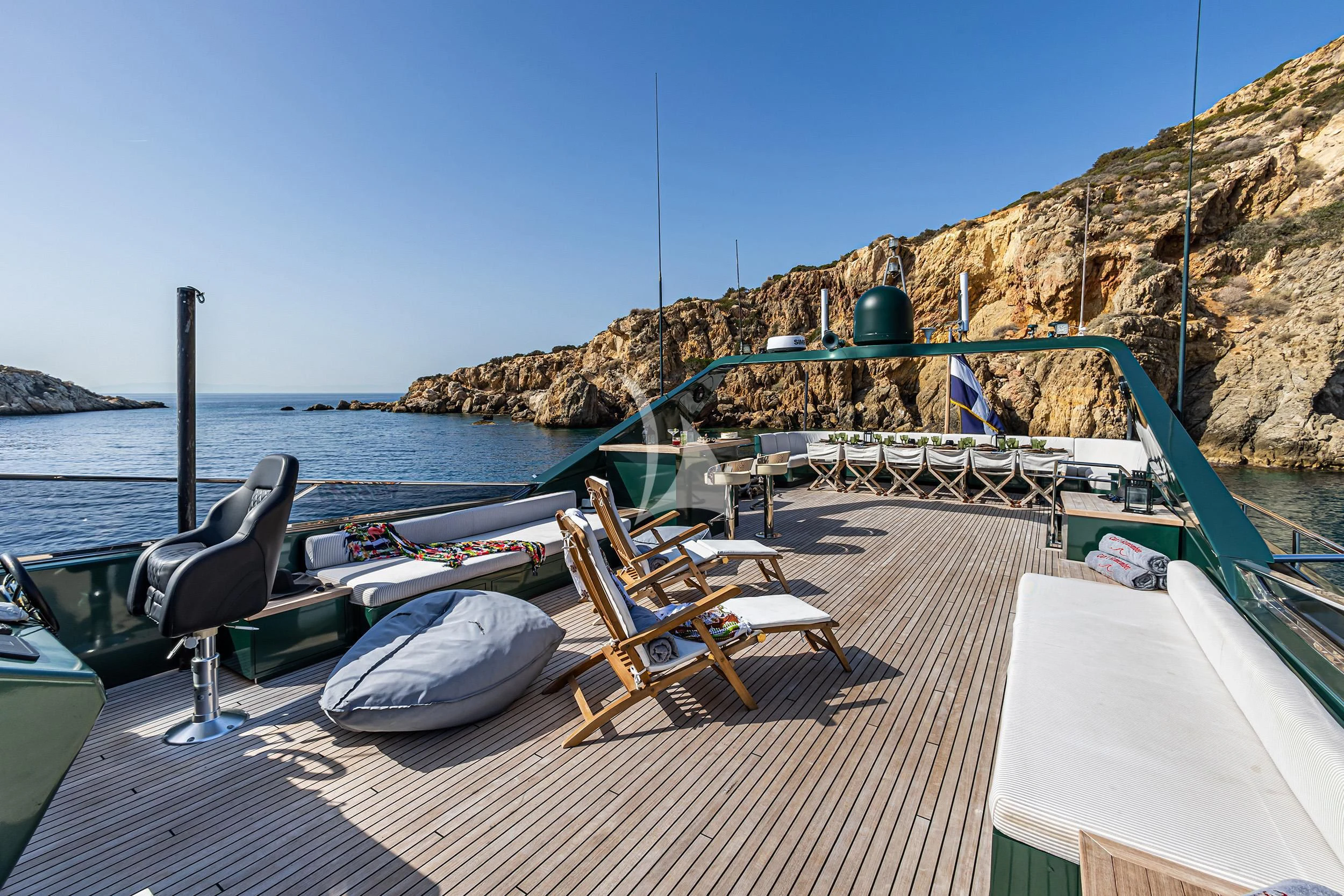 a deck with chairs and a table on it aboard CAN'T REMEMBER Yacht for Sale