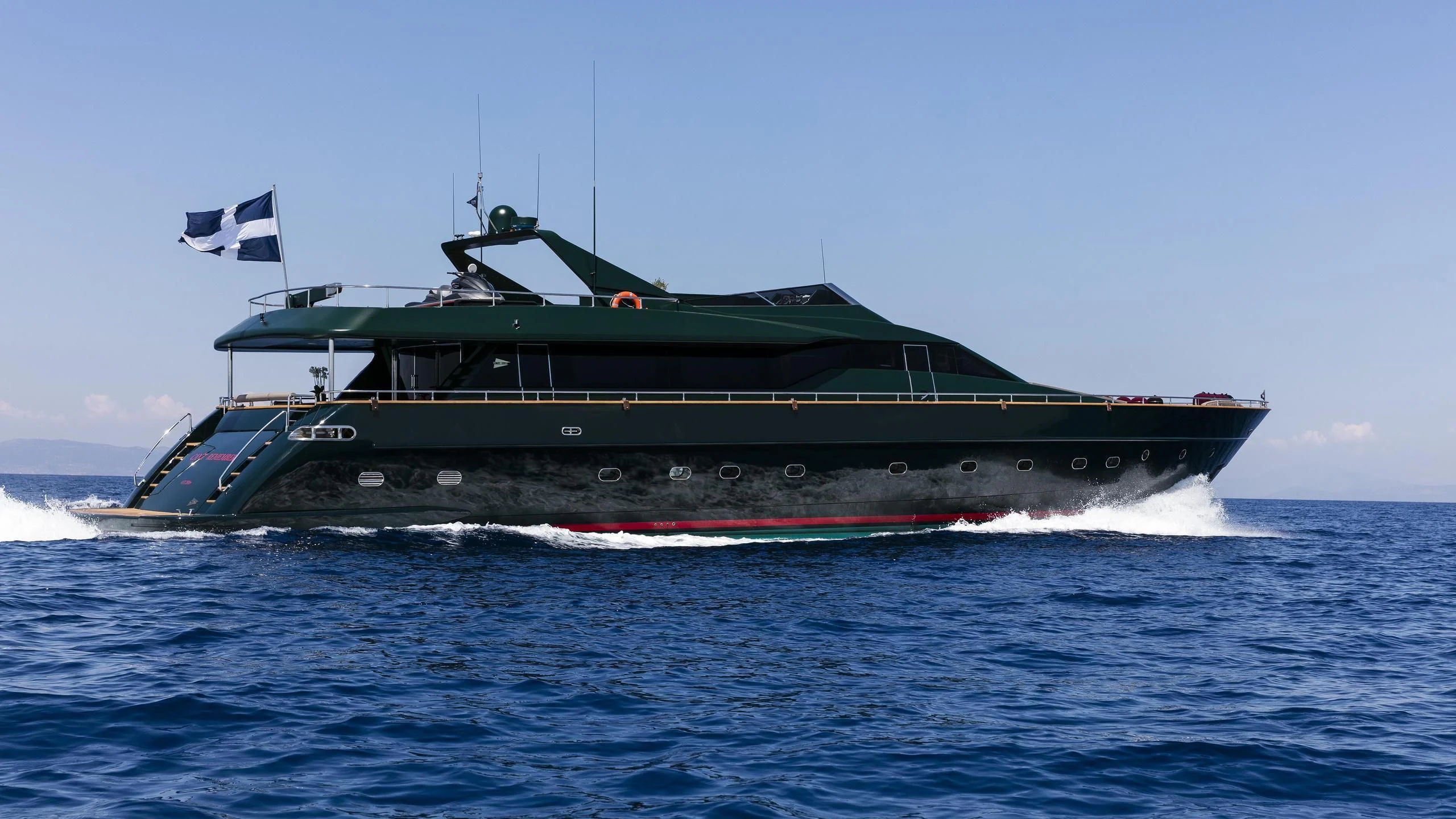 a large green boat in the water aboard CAN'T REMEMBER Yacht for Sale