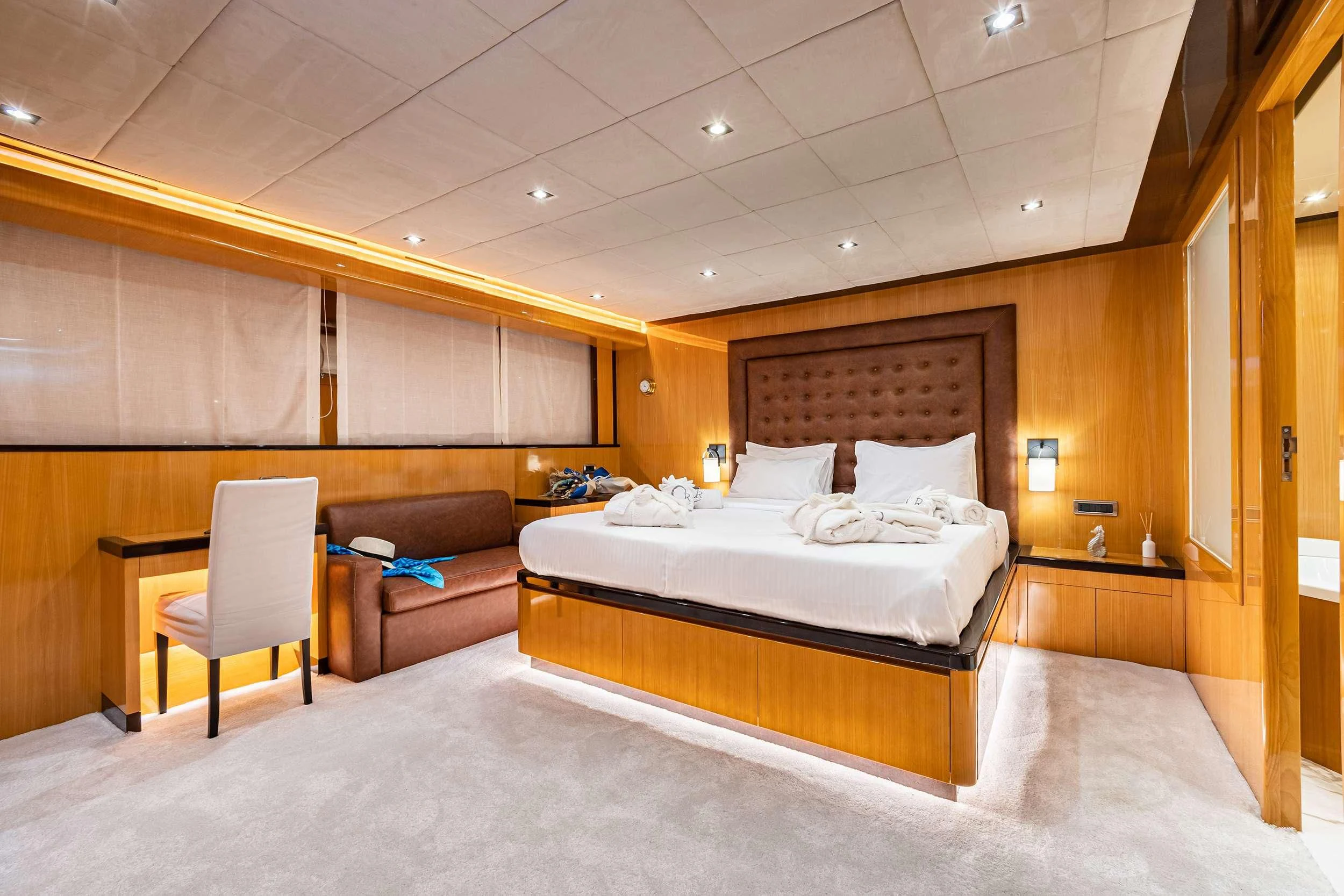 a room with a bed and a chair aboard CAN'T REMEMBER Yacht for Sale