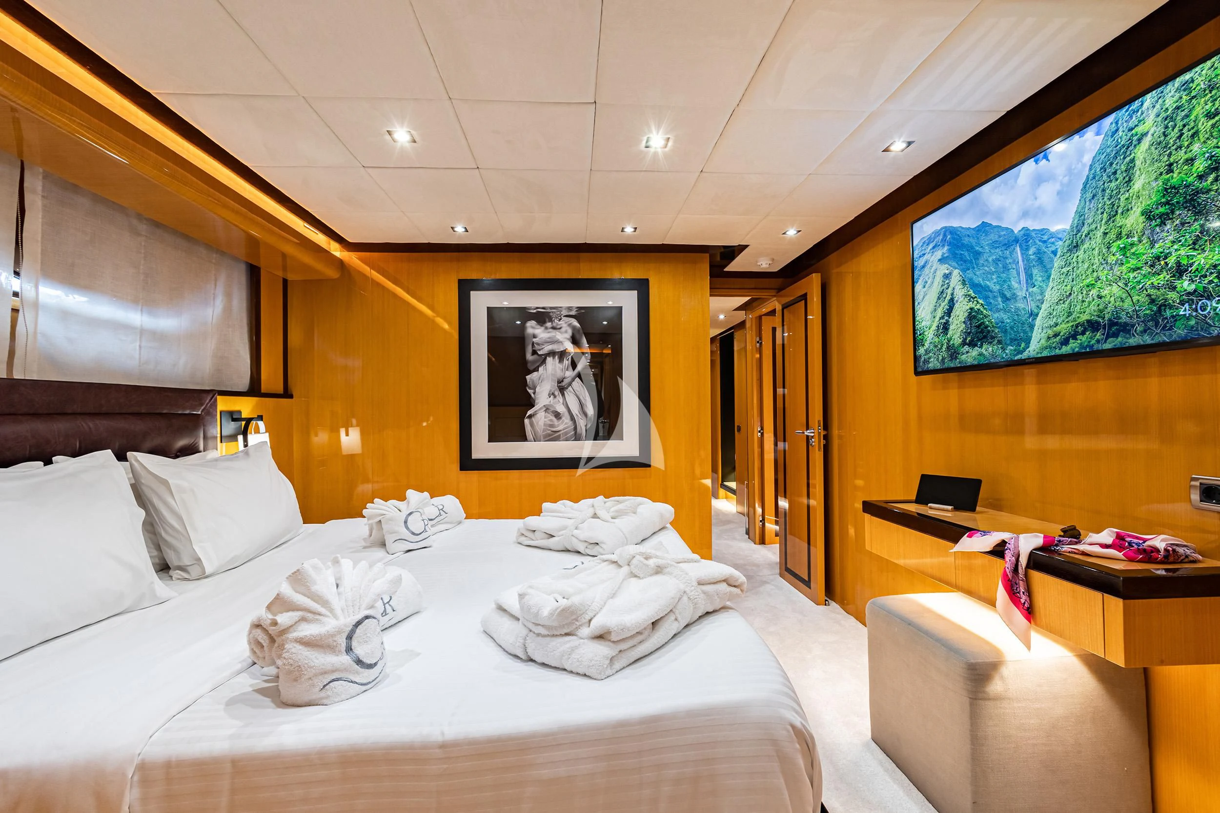 a room with a bed and a painting on the wall aboard CAN'T REMEMBER Yacht for Sale