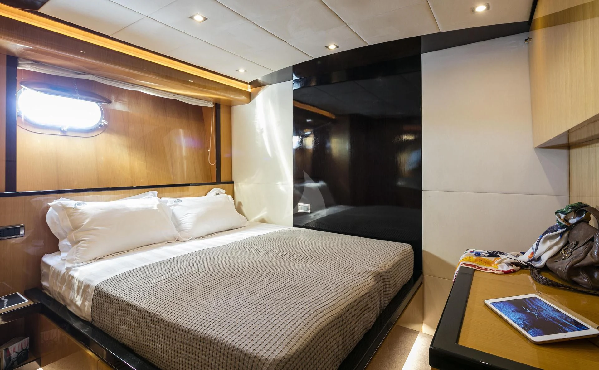 a bedroom with a bed and a desk aboard CAN'T REMEMBER Yacht for Sale