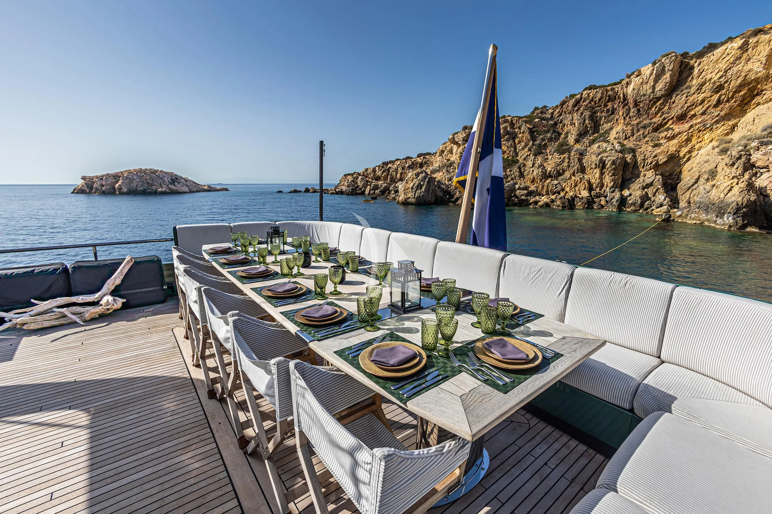 a table set for a meal on a boat on the water aboard CAN'T REMEMBER Yacht for Sale