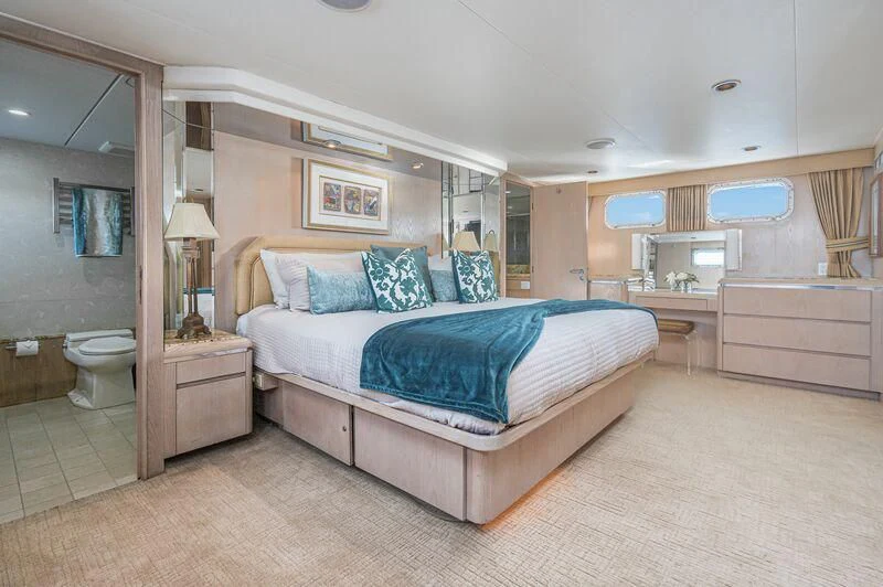 a large bedroom with a large bed aboard PANACHE Yacht for Sale