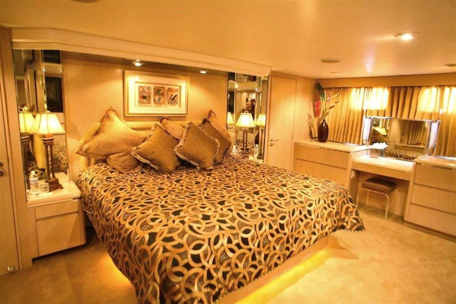 a large bed in a hotel room aboard PANACHE Yacht for Sale