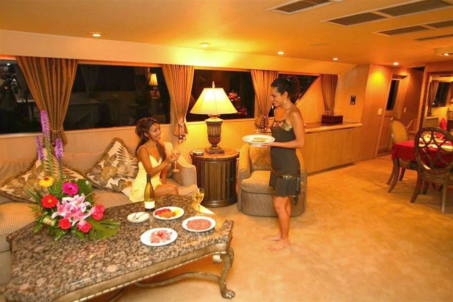 a couple of women in a living room aboard PANACHE Yacht for Sale