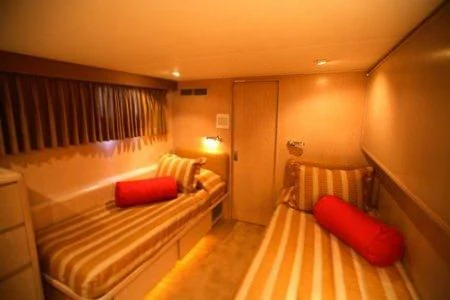 a room with two beds aboard PANACHE Yacht for Sale