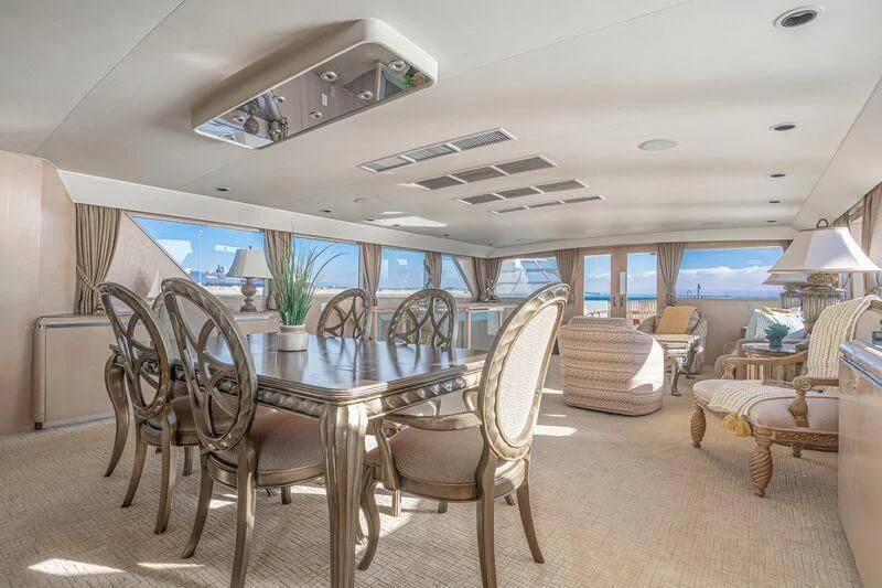 a dining room with a table and chairs aboard PANACHE Yacht for Sale