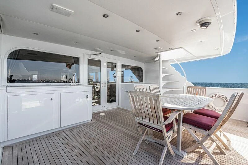 a room with a table and chairs aboard PANACHE Yacht for Sale
