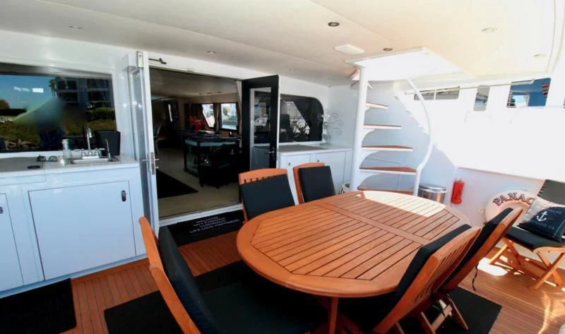 a room with a table and chairs aboard PANACHE Yacht for Sale