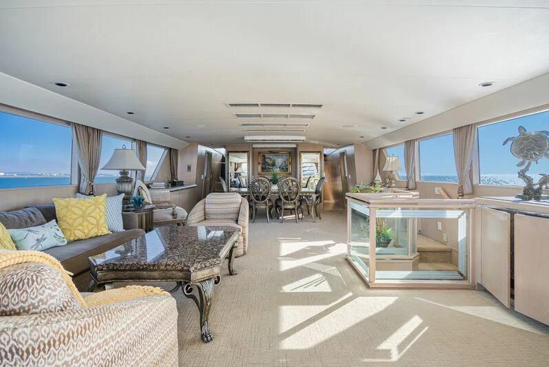 a living room with a large window aboard PANACHE Yacht for Sale