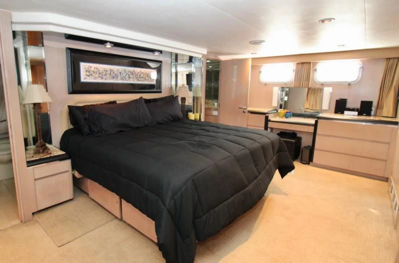 a bedroom with a large bed aboard PANACHE Yacht for Sale