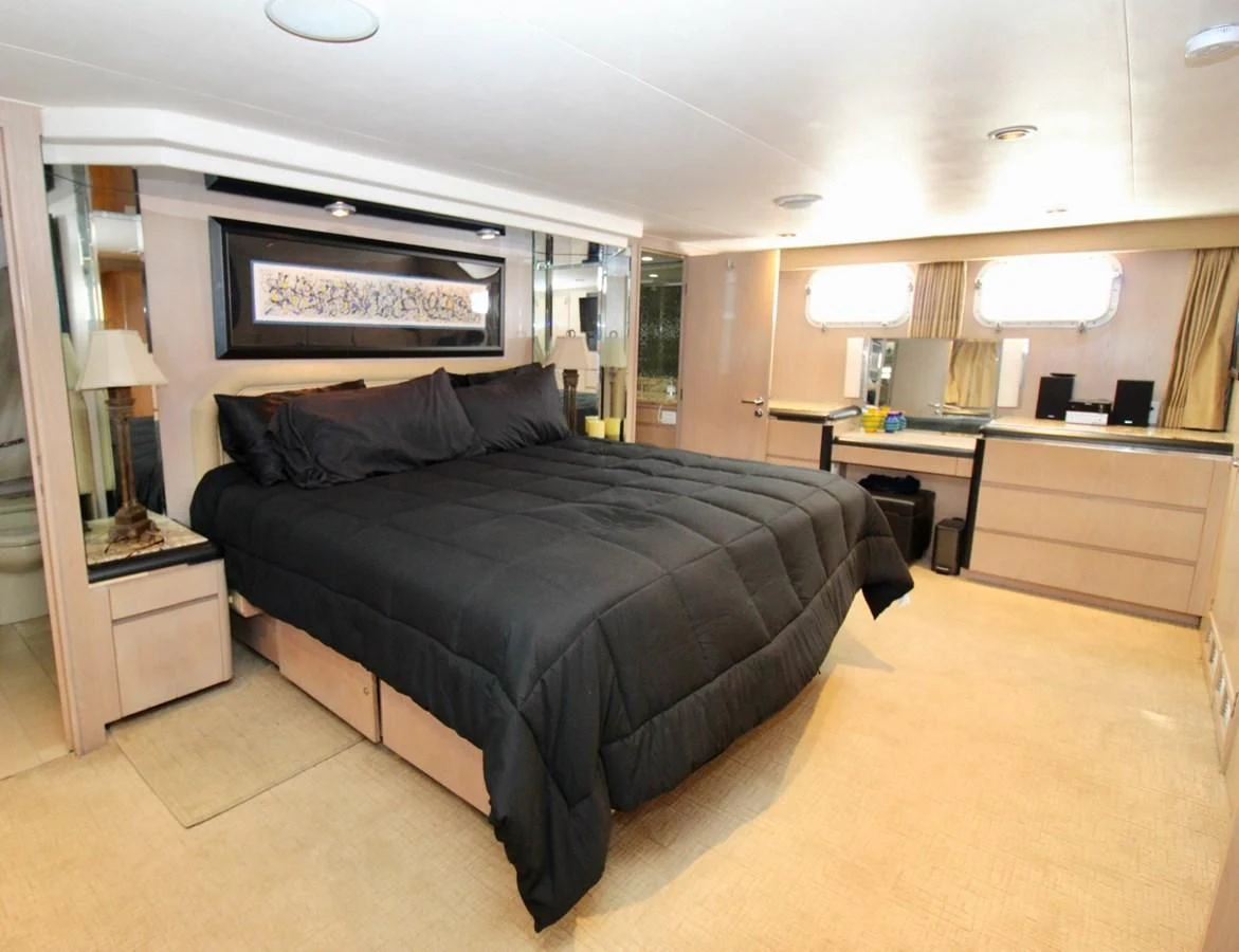 a large bed in a room aboard PANACHE Yacht for Sale