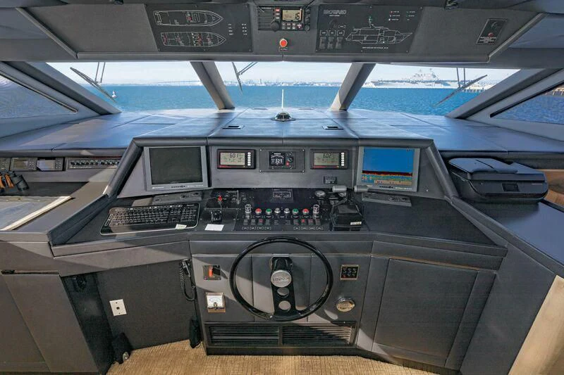 a black console with a keyboard and monitor on it aboard PANACHE Yacht for Sale