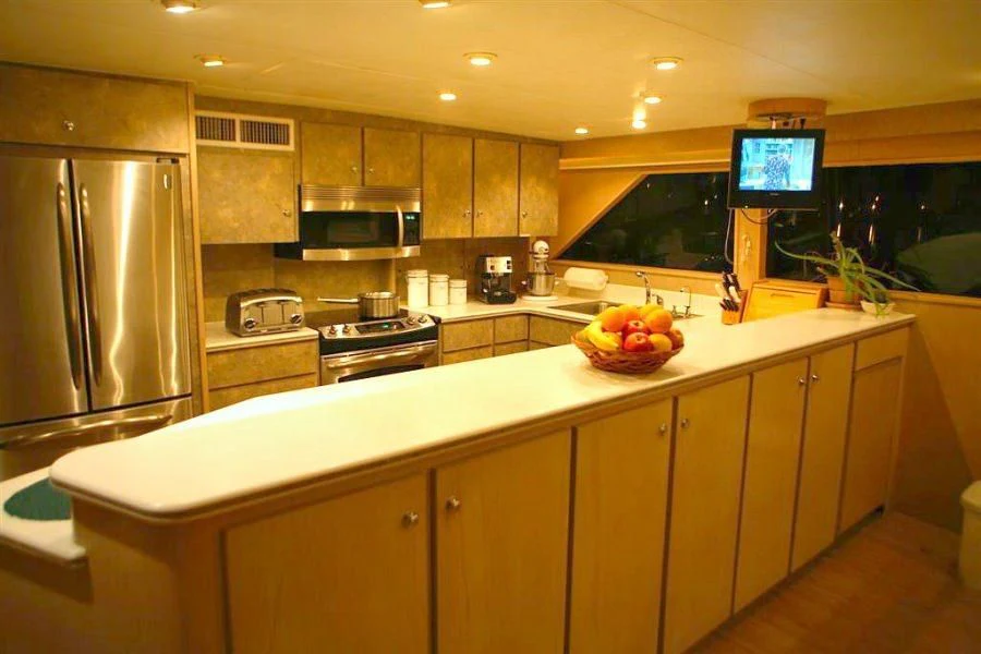 a kitchen with a large island aboard PANACHE Yacht for Sale