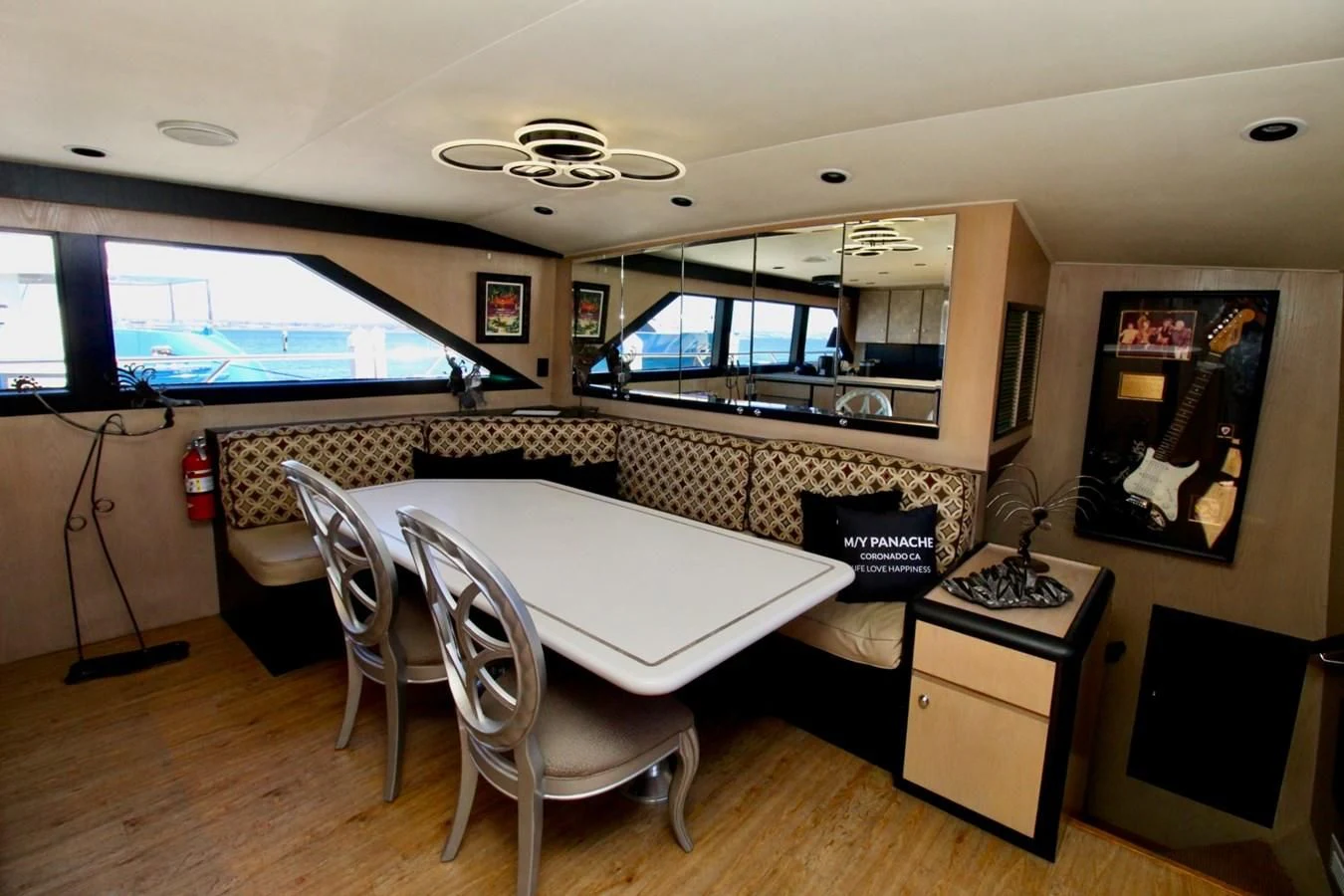 a room with a table and chairs aboard PANACHE Yacht for Sale