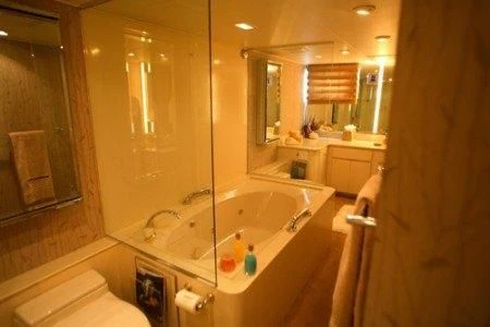 a bathroom with a bathtub and sink aboard PANACHE Yacht for Sale