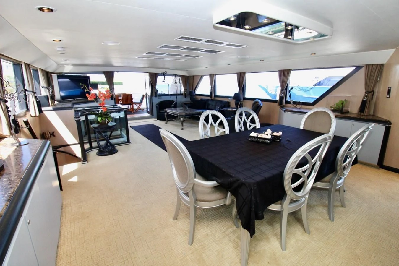 a large kitchen with a table and chairs aboard PANACHE Yacht for Sale