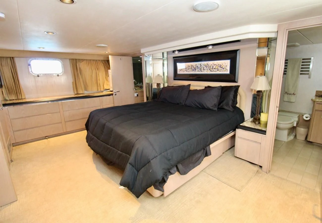 a bed in a room aboard PANACHE Yacht for Sale