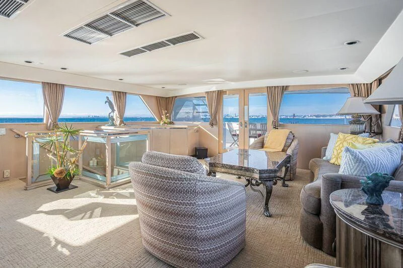 a living room with a large window aboard PANACHE Yacht for Sale