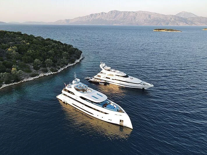 a couple of boats sit in the water aboard HARBOUR MOON Yacht for Sale