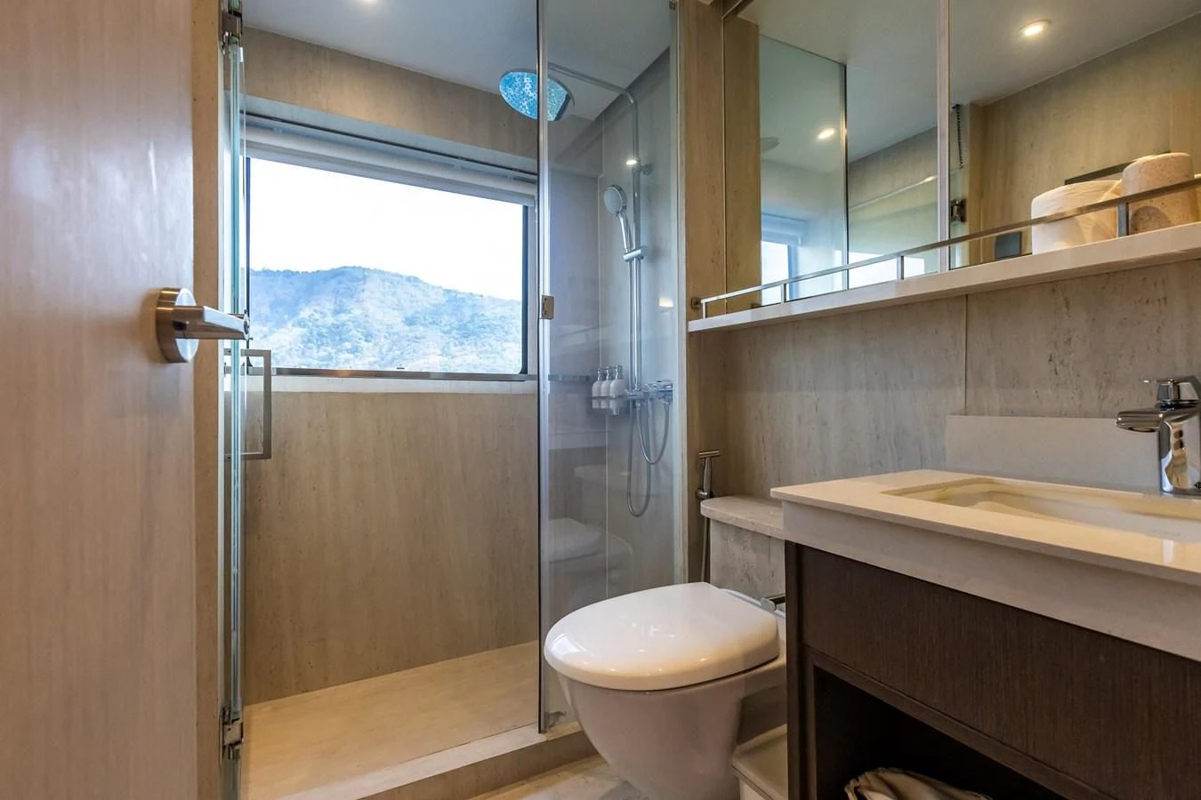 a bathroom with a glass shower door aboard VANORA Yacht for Sale