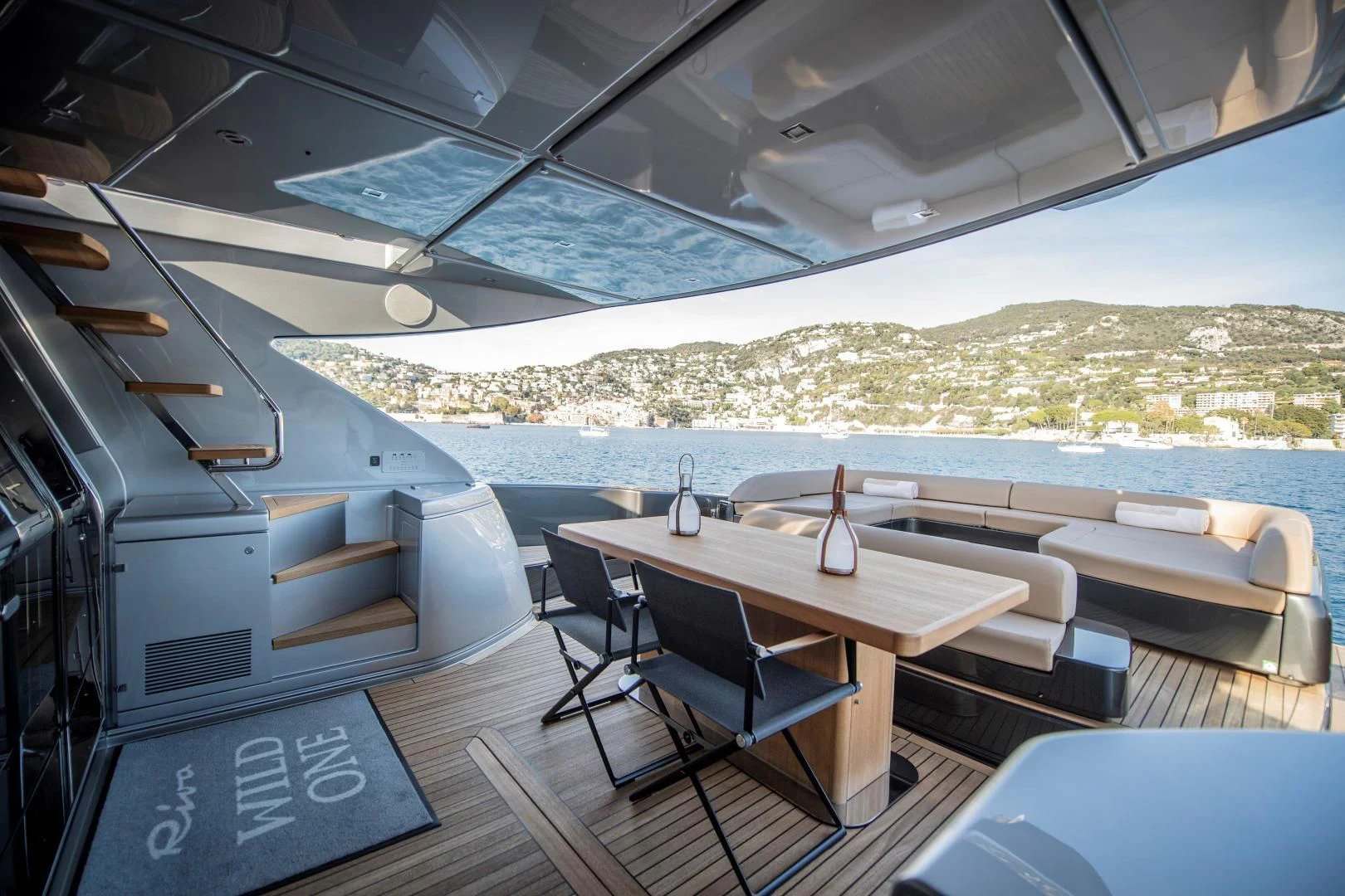 a room with a table and chairs aboard WILDONE Yacht for Sale