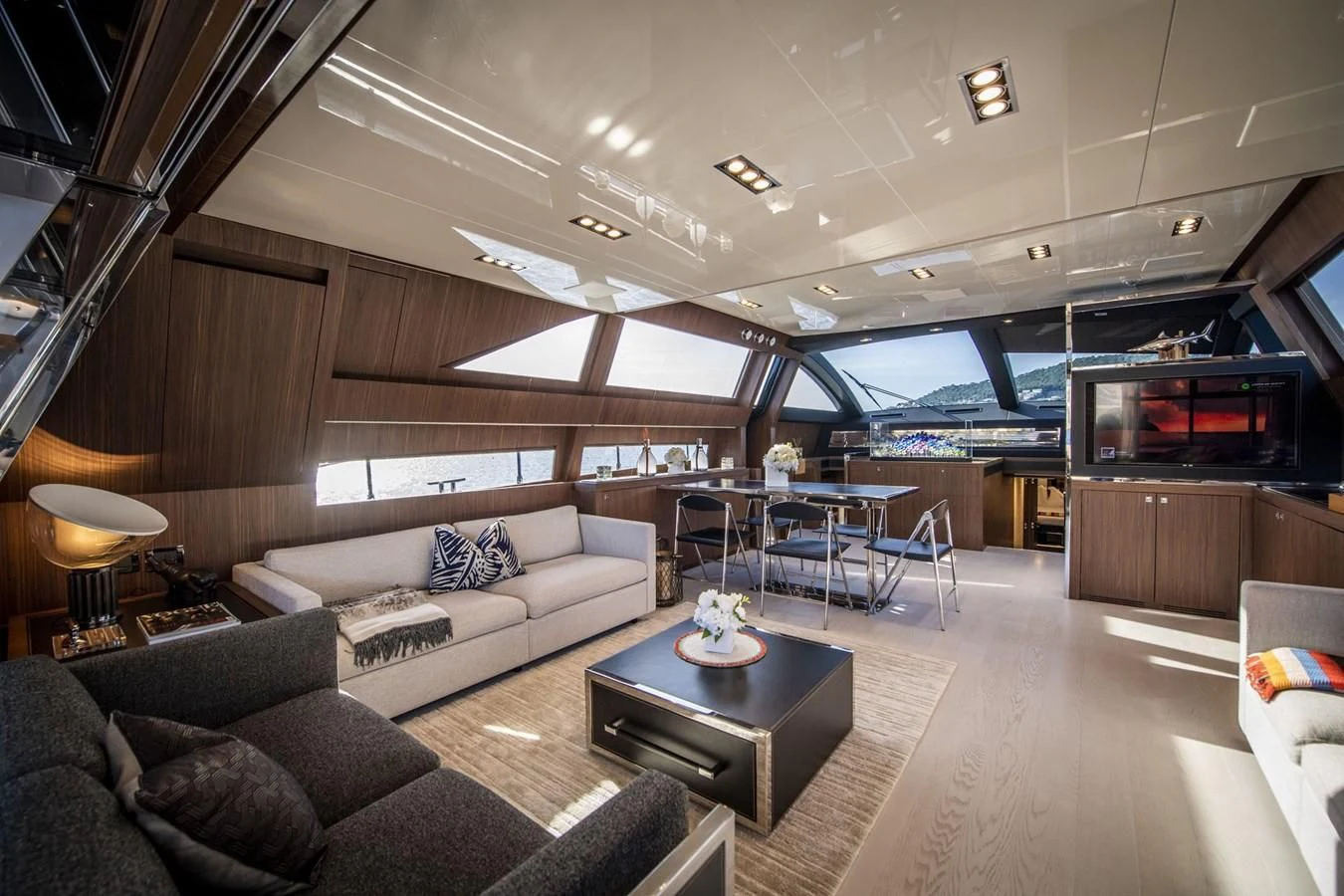 a living room with a couch and a television aboard WILDONE Yacht for Sale