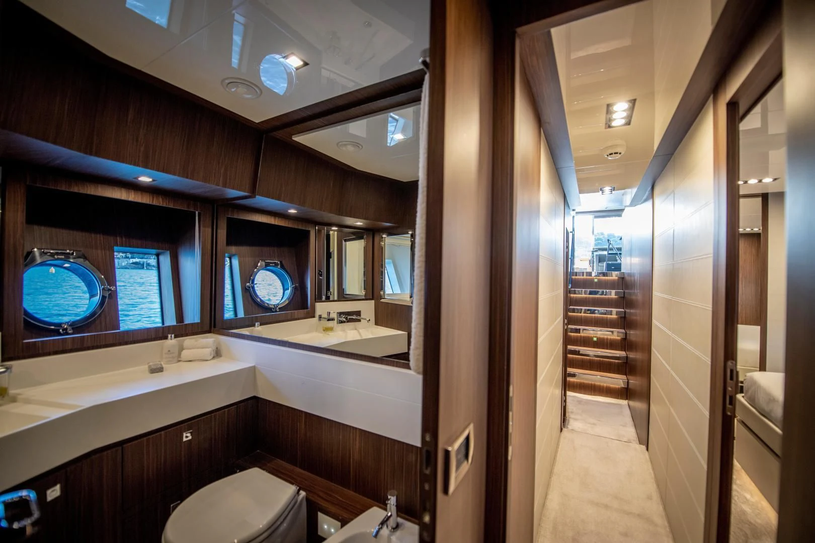 a bathroom with a wood door aboard WILDONE Yacht for Sale