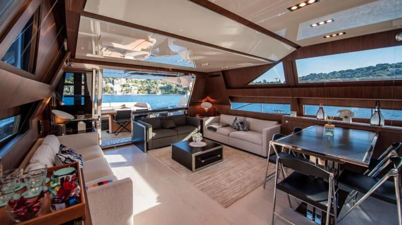 a living room with a large window aboard WILDONE Yacht for Sale