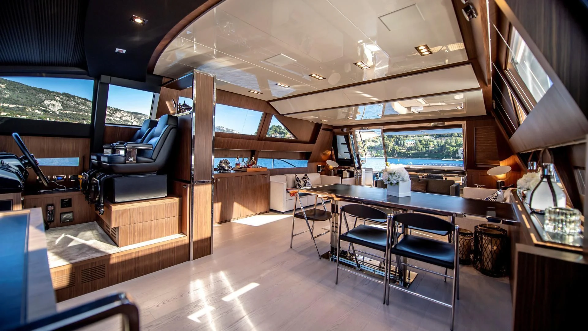 a room with a table and chairs aboard WILDONE Yacht for Sale