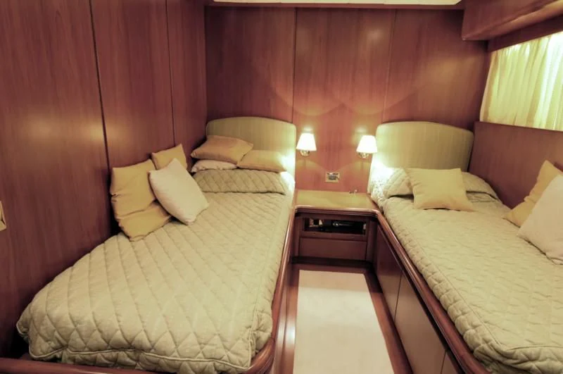 a room with two beds aboard TOI MOI ET ROBY Yacht for Sale