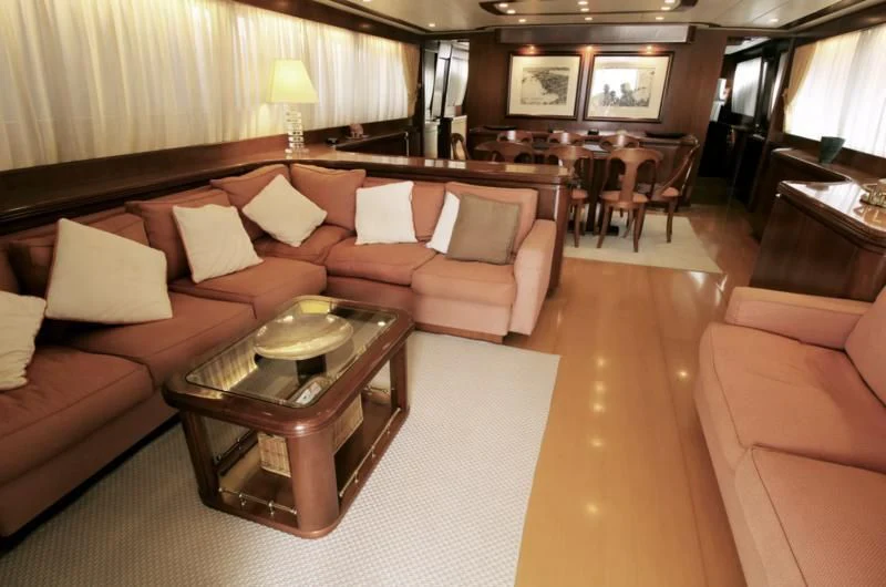 a living room with a couch and a coffee table aboard TOI MOI ET ROBY Yacht for Sale