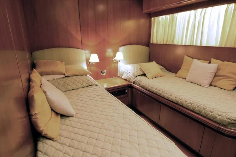 a couple of beds in a hotel room aboard TOI MOI ET ROBY Yacht for Sale