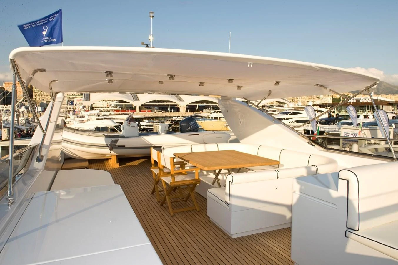 a boat deck with a flag aboard TOI MOI ET ROBY Yacht for Sale